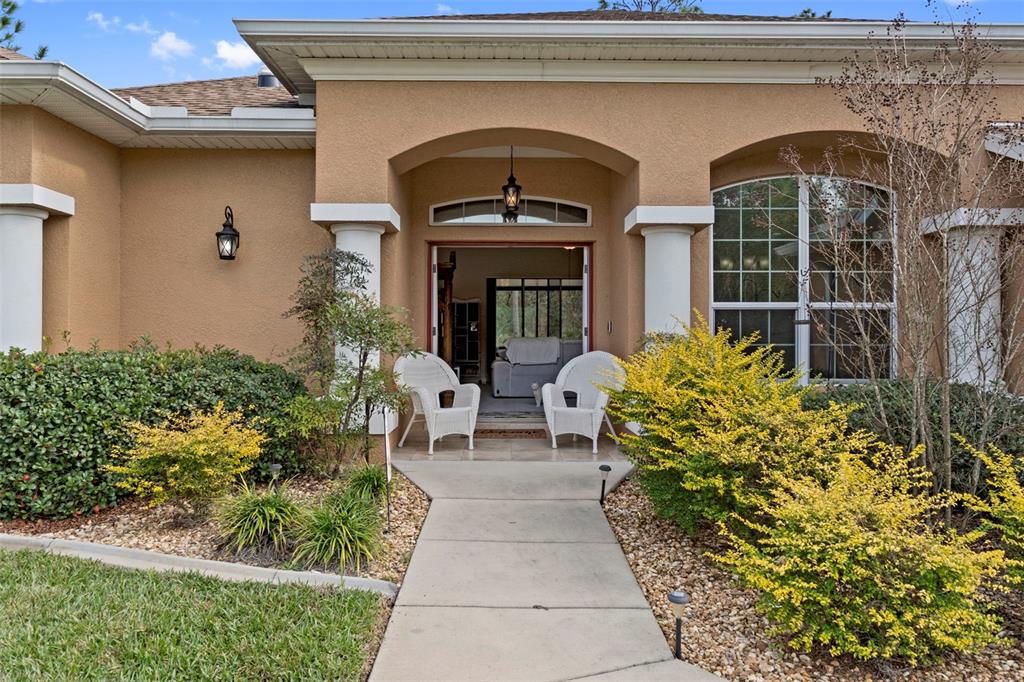 39 Linder Street Homosassa, FL 34446 - Photo 4 of 63 a view of house with outdoor seating space