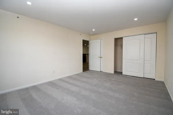a view of a patio with a floor to ceiling window