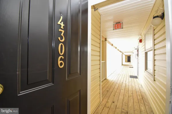 a view of kitchen and wooden floor