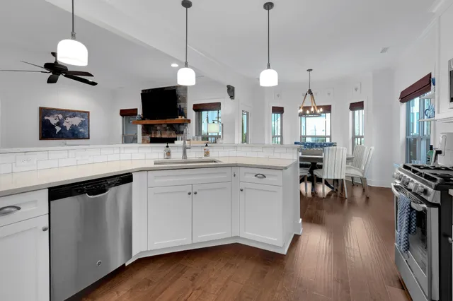 a view of a dining room with furniture and a mirror