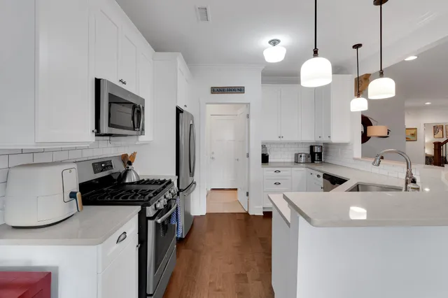 a bedroom with a bed and a ceiling fan