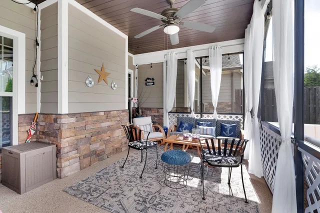 a view of living room with furniture and flat screen tv