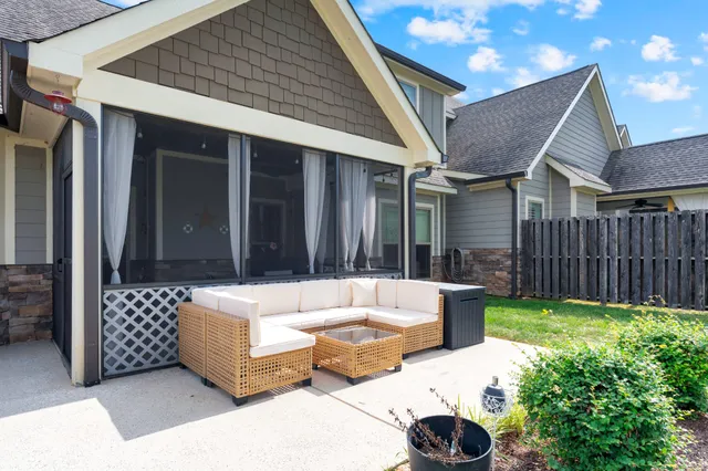 a bedroom with furniture and a flat screen tv