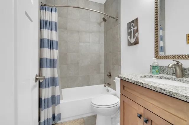 an aerial view of a house with a lake view