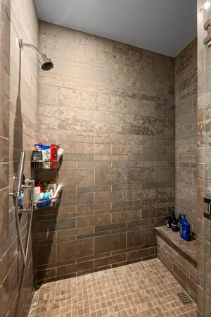 a bathroom with a tub and shower