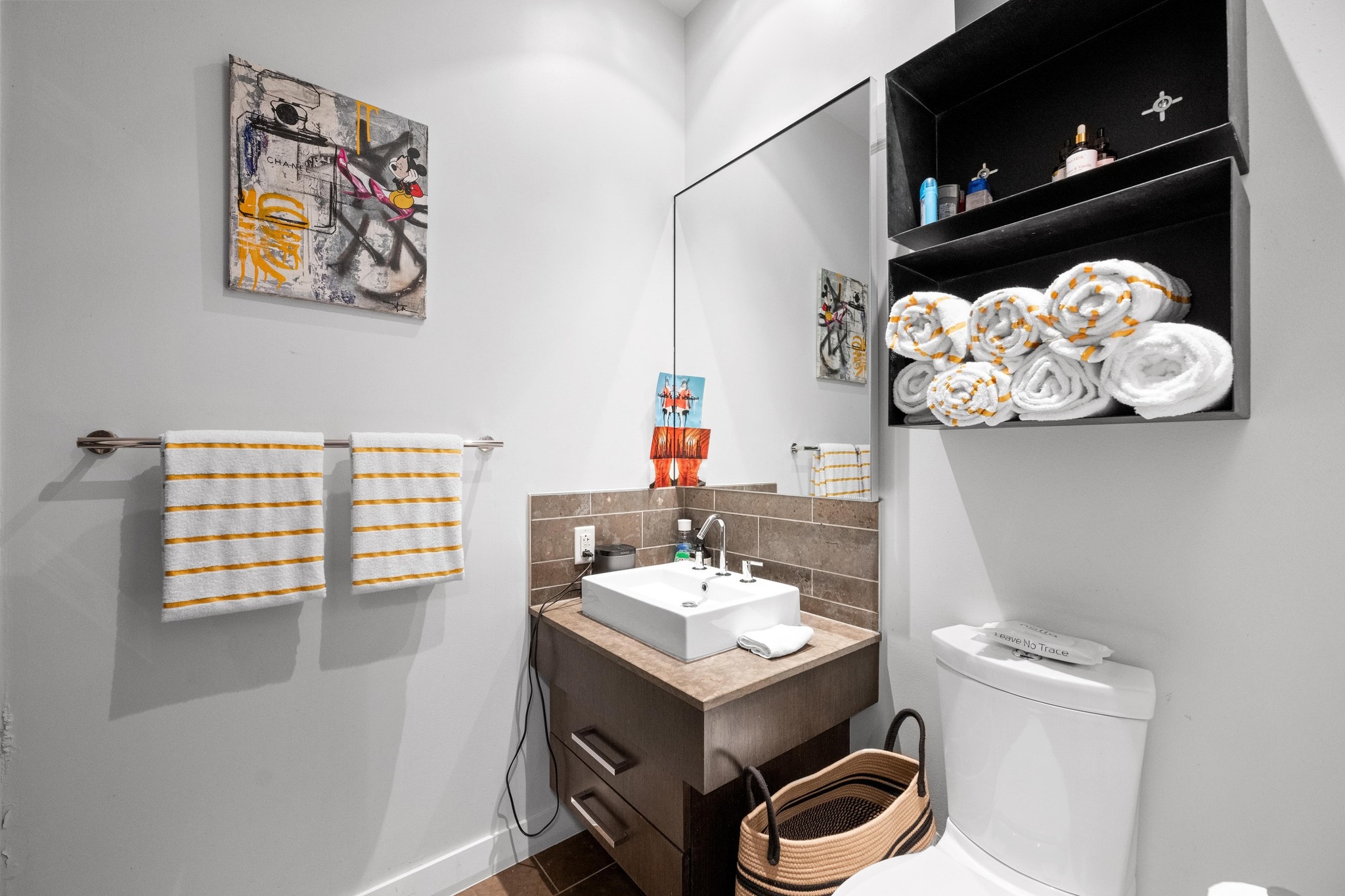 210 Lavaca Street, Unit 1911 Austin, TX 78701 - Photo 13 of 18 a bathroom with a sink and a mirror