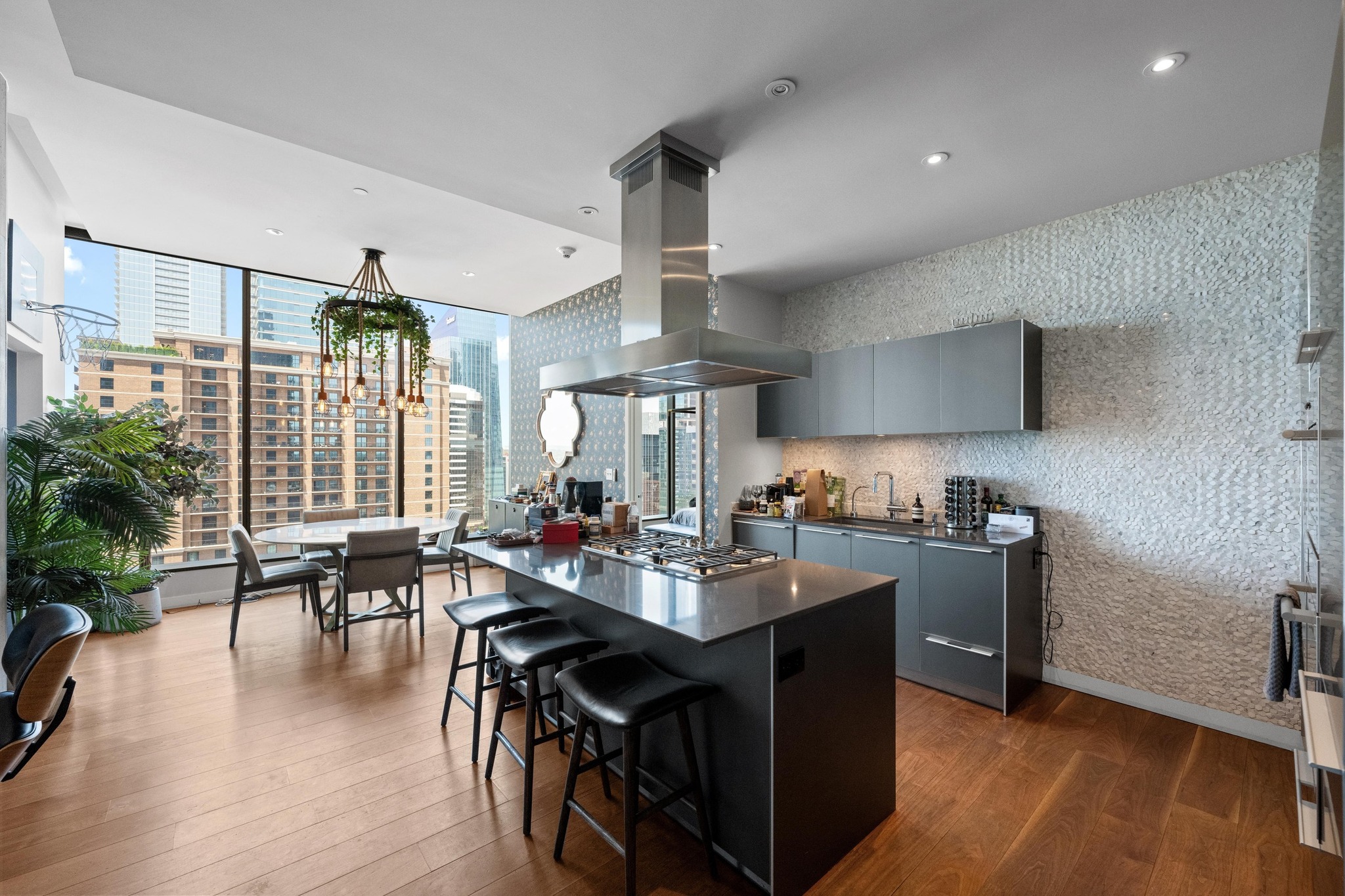 210 Lavaca Street, Unit 1911 Austin, TX 78701 - Photo 5 of 18 a kitchen with sink cabinets and wooden floor