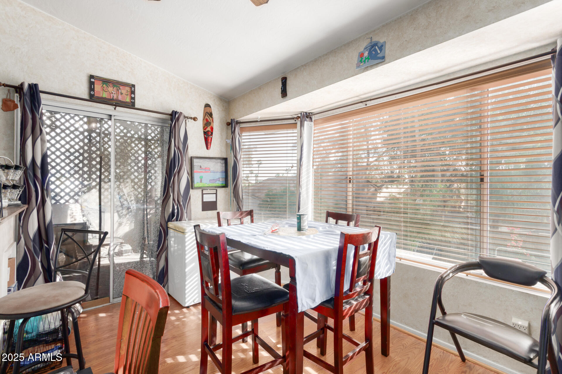 1704 South 39th Street, Unit 24 Mesa, AZ 85206 - Photo 11 of 20 a dining room with furniture and large windows