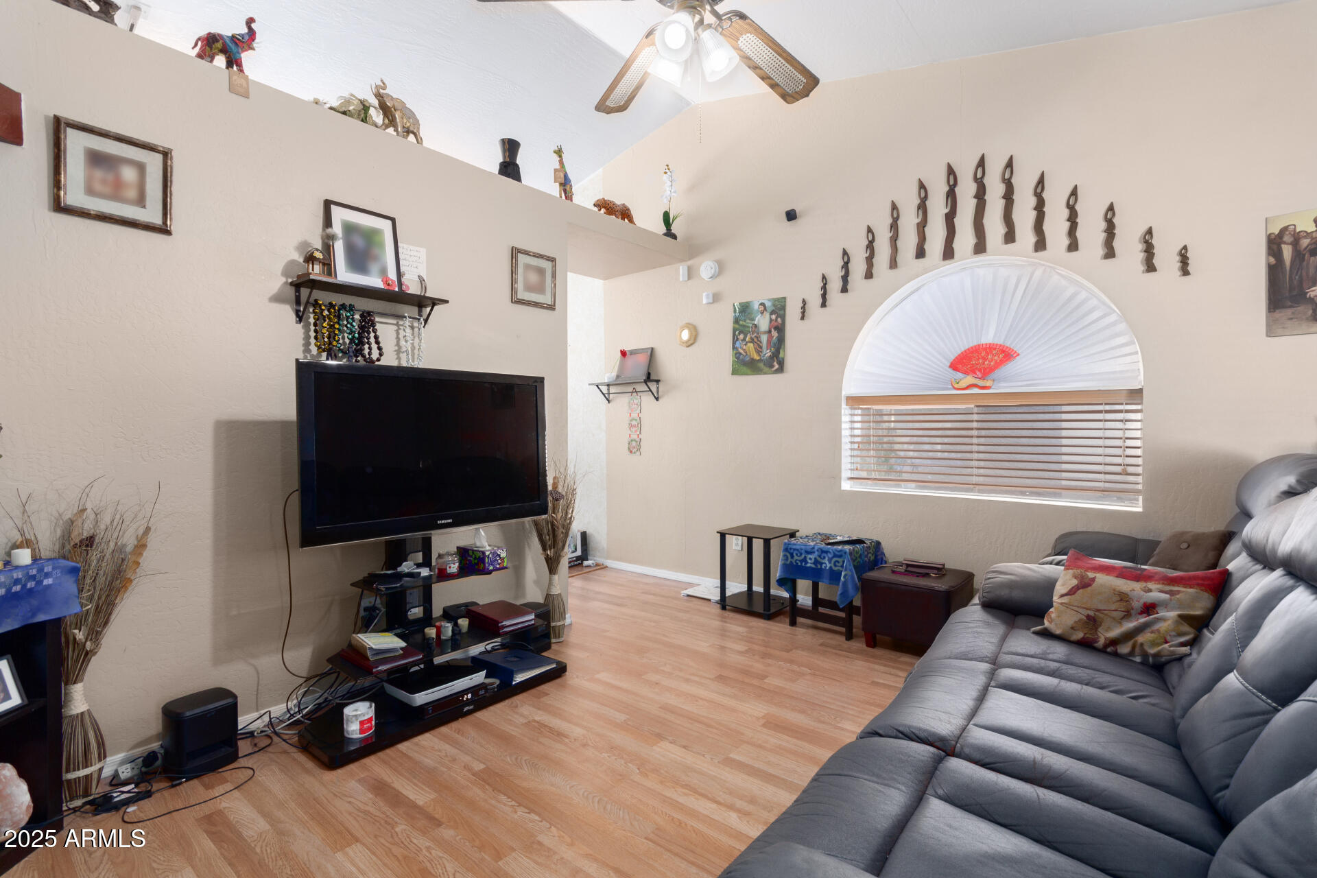 1704 South 39th Street, Unit 24 Mesa, AZ 85206 - Photo 7 of 20 a living room with furniture and a flat screen tv