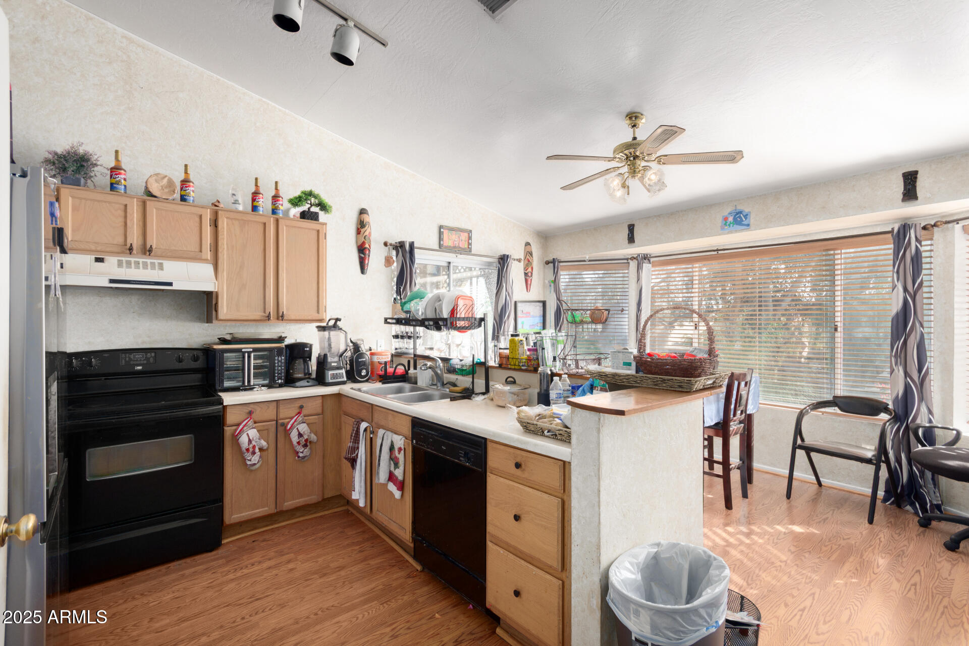 1704 South 39th Street, Unit 24 Mesa, AZ 85206 - Photo 8 of 20 a kitchen with a sink cabinets and window
