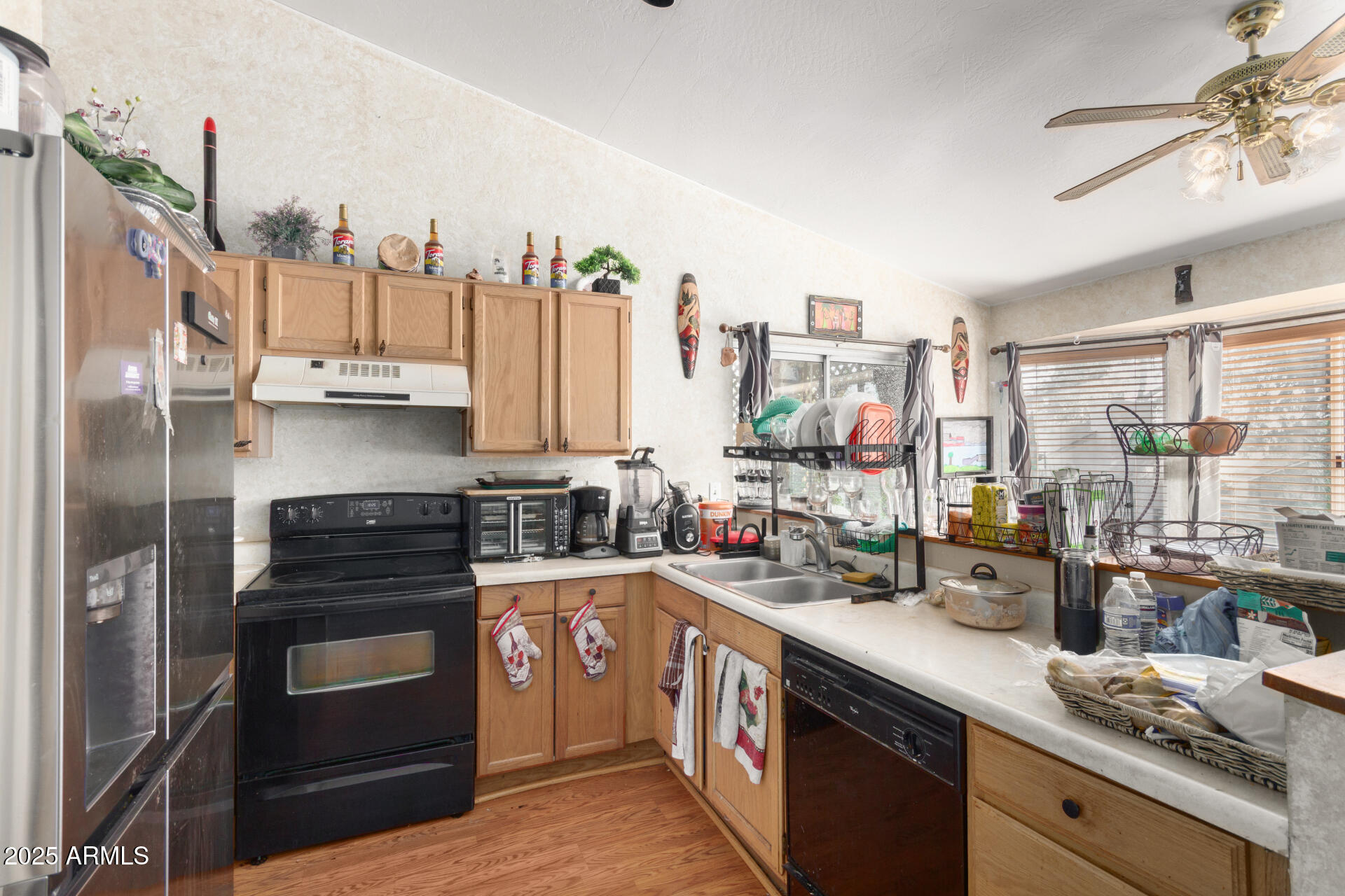 1704 South 39th Street, Unit 24 Mesa, AZ 85206 - Photo 9 of 20 a kitchen with a sink stove and cabinets