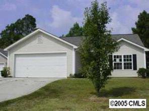 2516 Captains Watch Road Northeast Kannapolis, NC 28083 - Photo 1 of 1 a front view of a house with a garden and yard