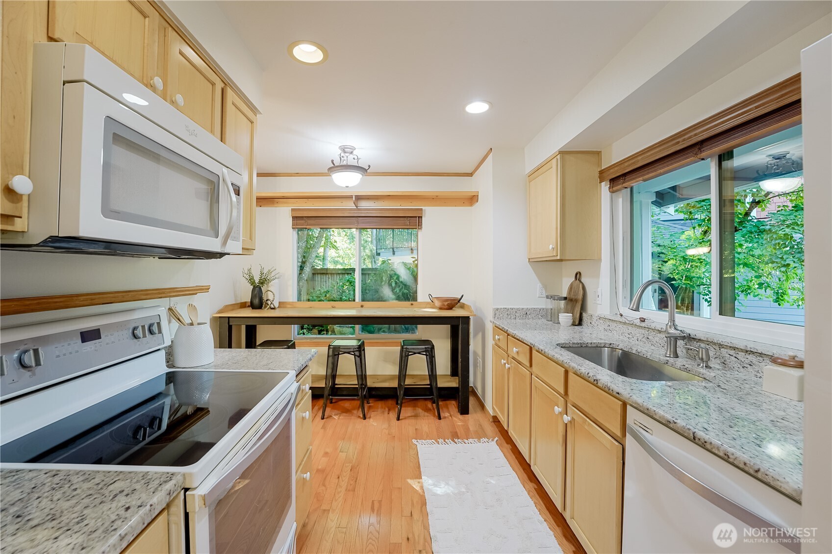 2201 192nd Street Southeast, Unit P4 Bothell, WA 98012 - Photo 15 of 28 a kitchen with a stove a sink and a microwave