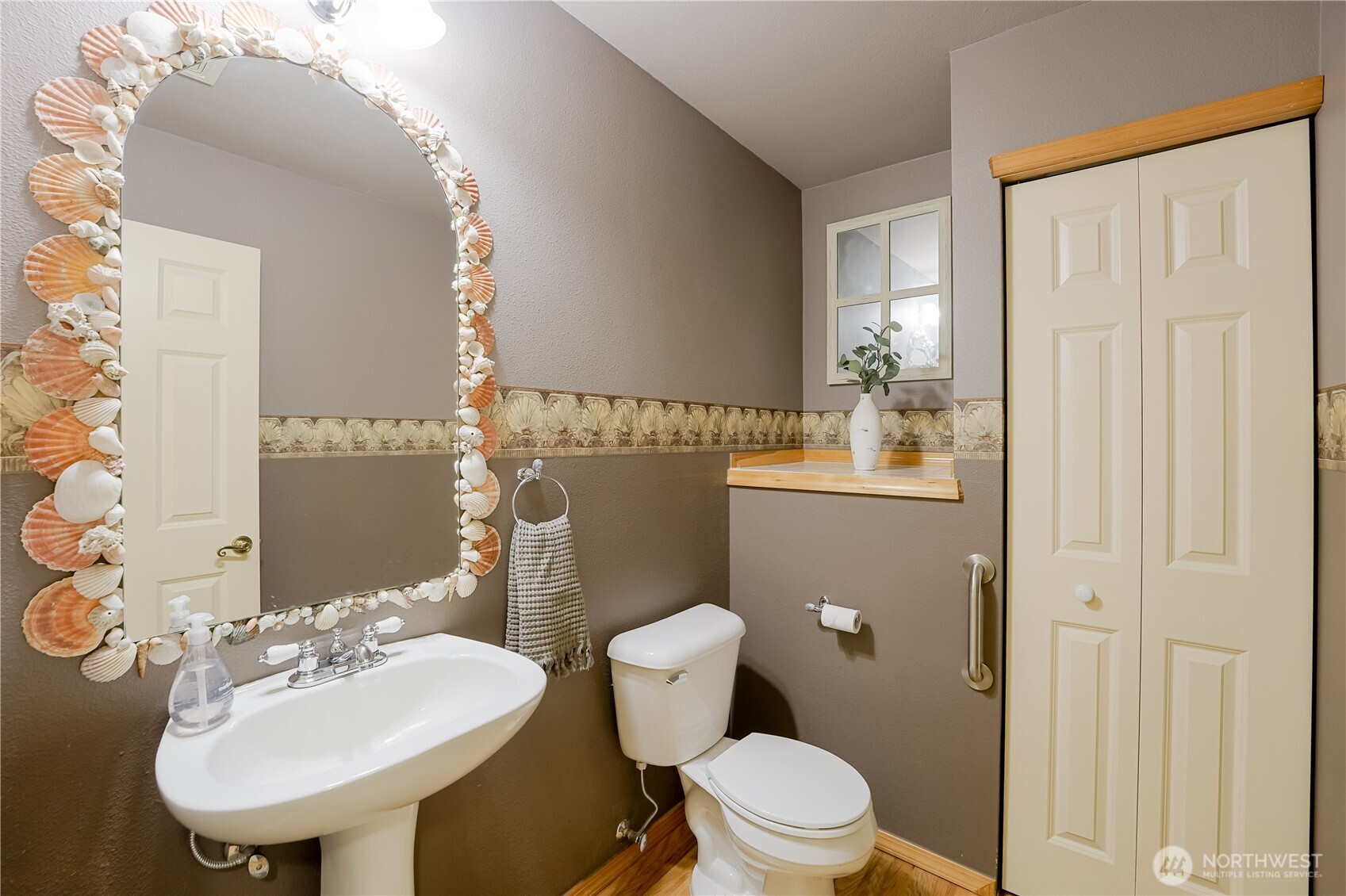 2201 192nd Street Southeast, Unit P4 Bothell, WA 98012 - Photo 17 of 28 a bathroom with a sink a toilet and mirror