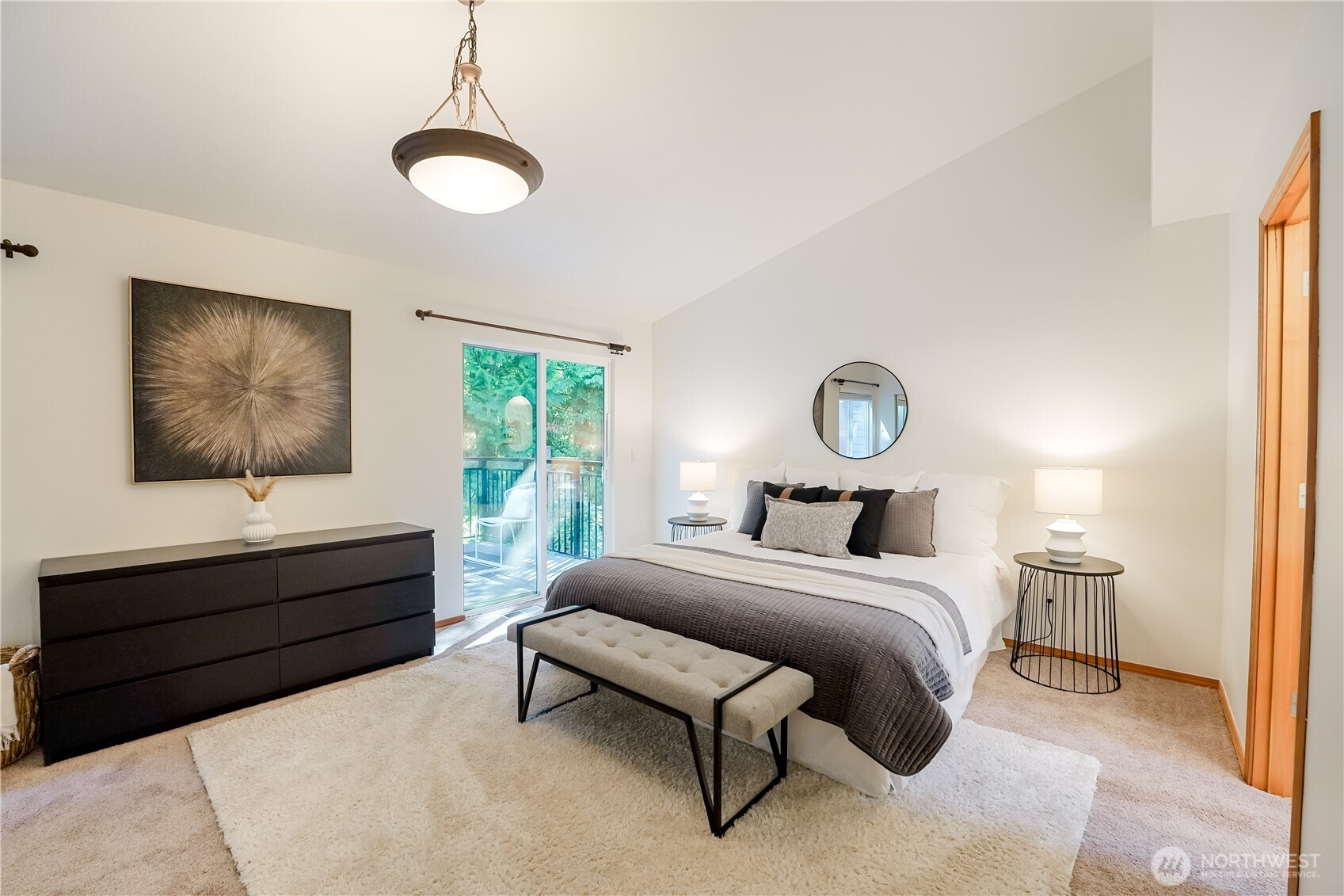 2201 192nd Street Southeast, Unit P4 Bothell, WA 98012 - Photo 18 of 28 a bedroom with a bed and a chandelier