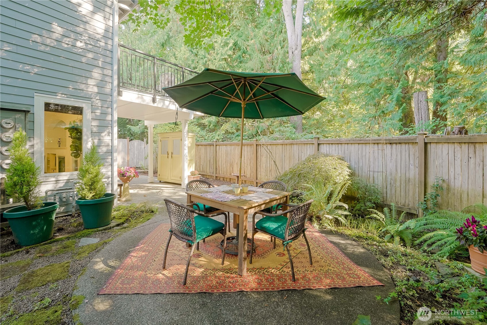 2201 192nd Street Southeast, Unit P4 Bothell, WA 98012 - Photo 26 of 28 a patio with a table and chairs