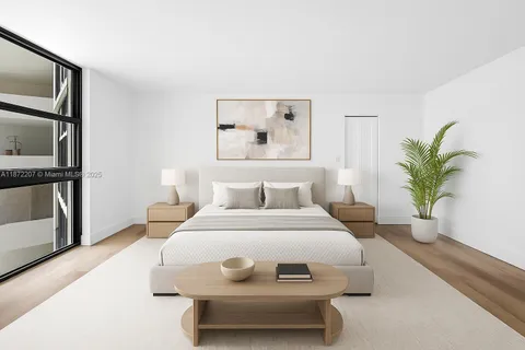 a bedroom with a bed and a potted plant