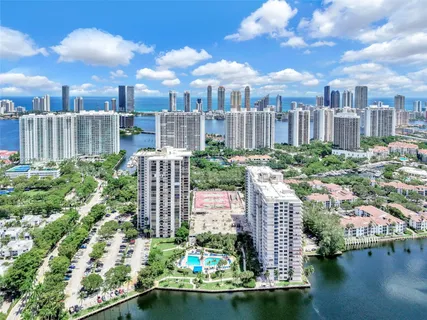 a view of a balcony with lake view and wooden floor