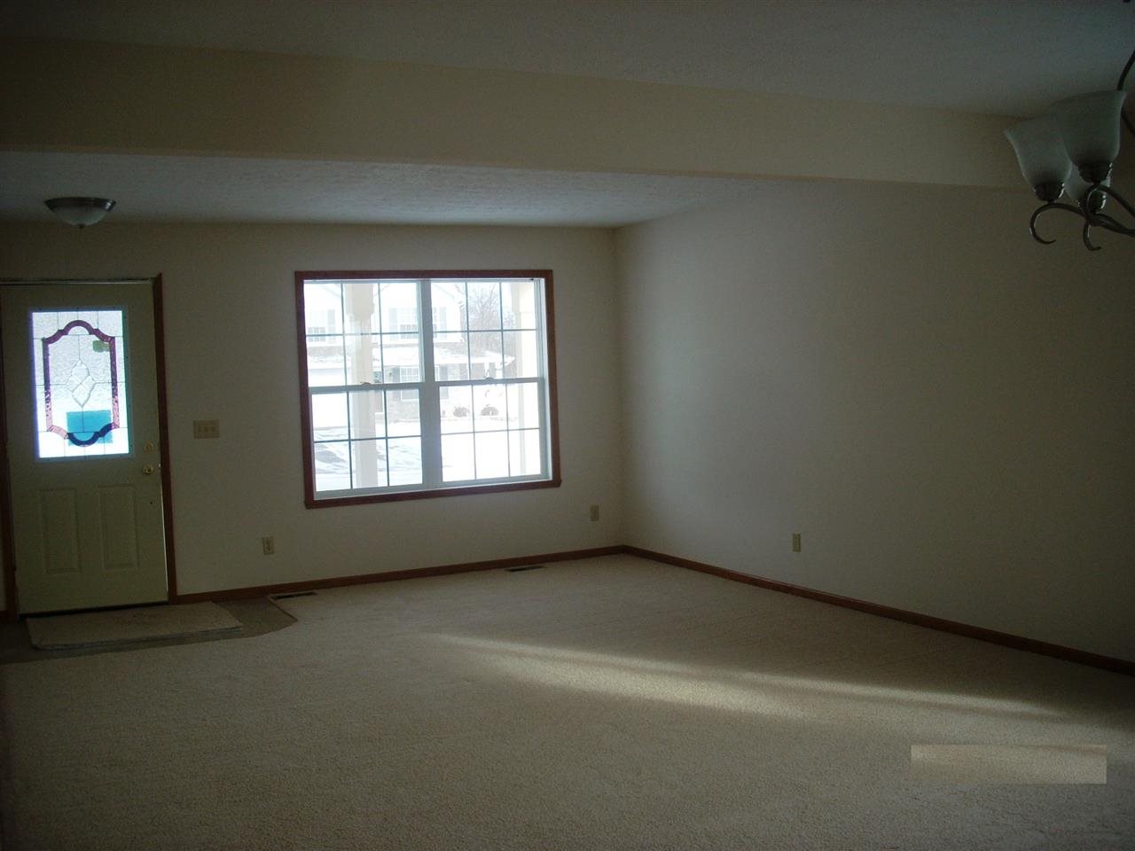 11090 Chicory Ridge Way Roscoe, IL 61073 - Photo 2 of 17 an empty room with a empty space and windows