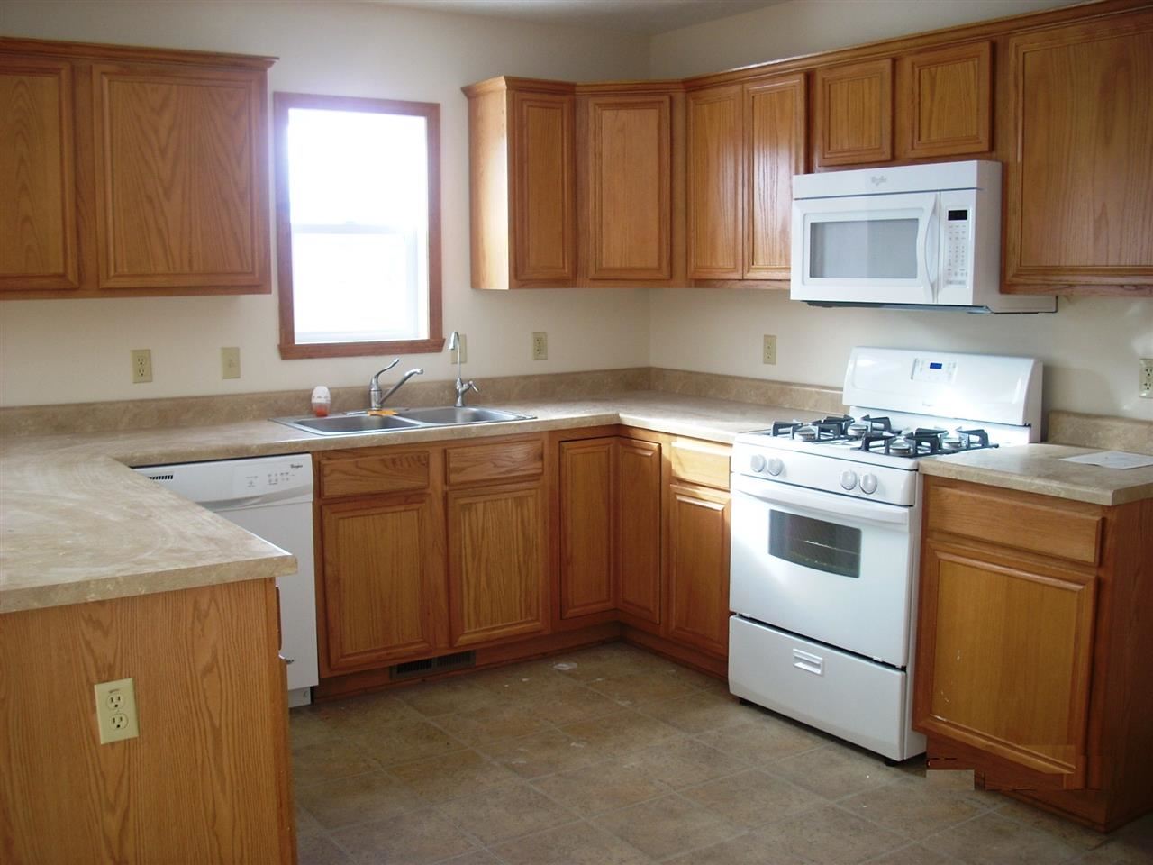 11090 Chicory Ridge Way Roscoe, IL 61073 - Photo 4 of 17 a kitchen with sink a microwave and cabinets