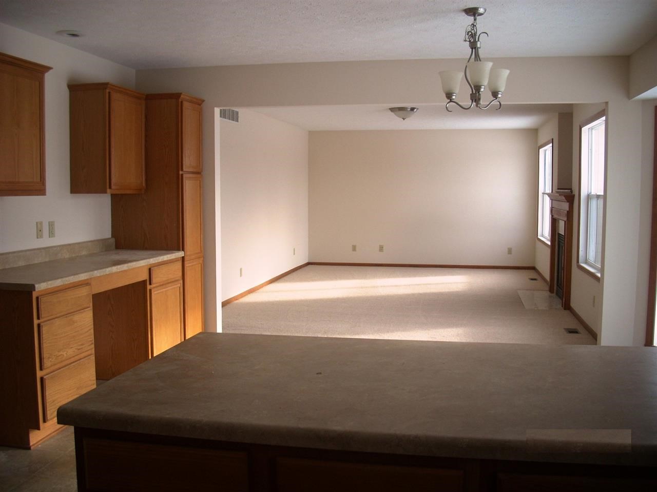 11090 Chicory Ridge Way Roscoe, IL 61073 - Photo 5 of 17 a view of kitchen with granite countertop cabinets and refrigerator