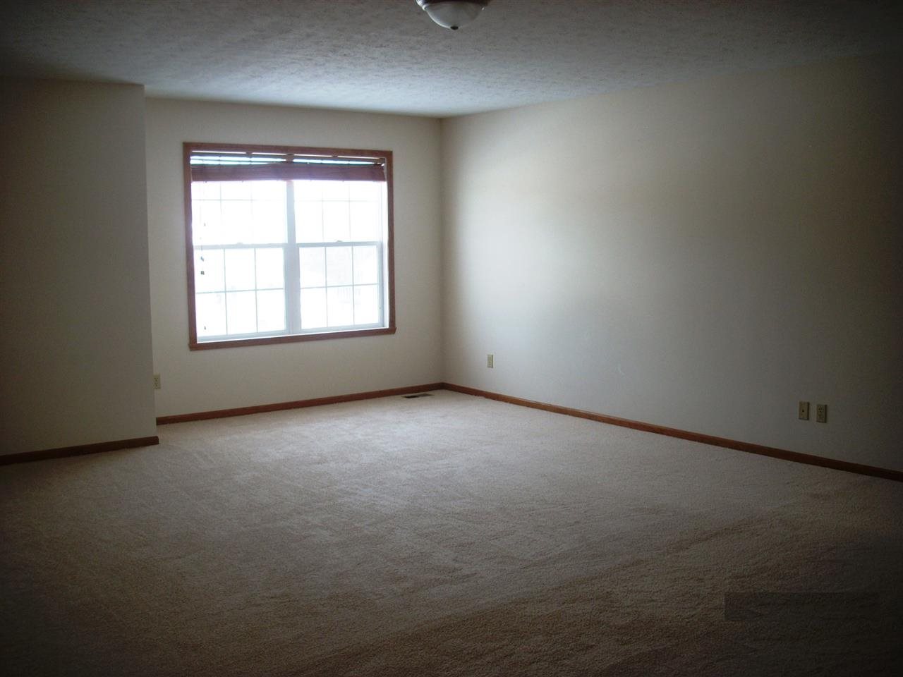 11090 Chicory Ridge Way Roscoe, IL 61073 - Photo 8 of 17 an empty room with a window