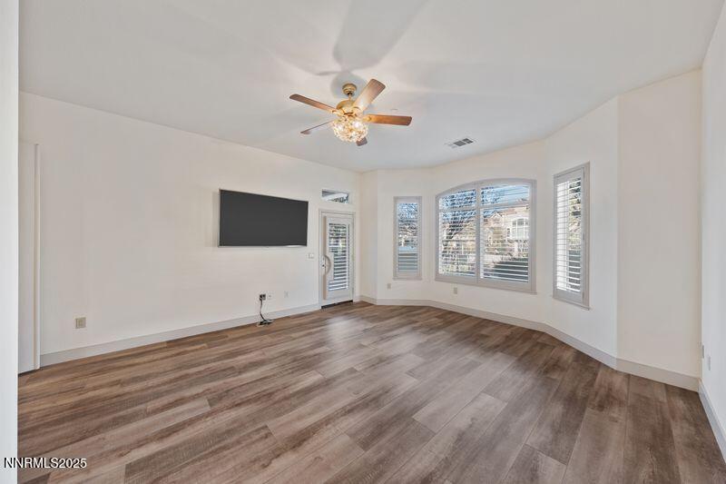 9900 Wilbur May Parkway, Unit 2501 Reno, NV 89521 - Photo 13 of 37 a view of an empty room with window and wooden floor