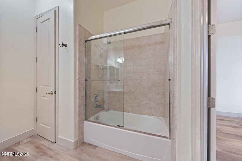 9900 Wilbur May Parkway, Unit 2501 Reno, NV 89521 - Photo 23 of 37 a bathroom with a bathtub and a shower