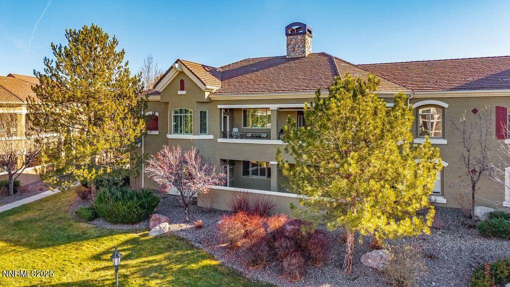 9900 Wilbur May Parkway, Unit 2501 Reno, NV 89521 - Photo 25 of 37 a front view of a house with a yard