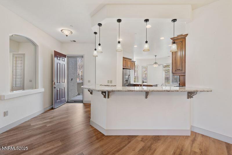 9900 Wilbur May Parkway, Unit 2501 Reno, NV 89521 - Photo 8 of 37 a view of a kitchen with wooden floor and a window