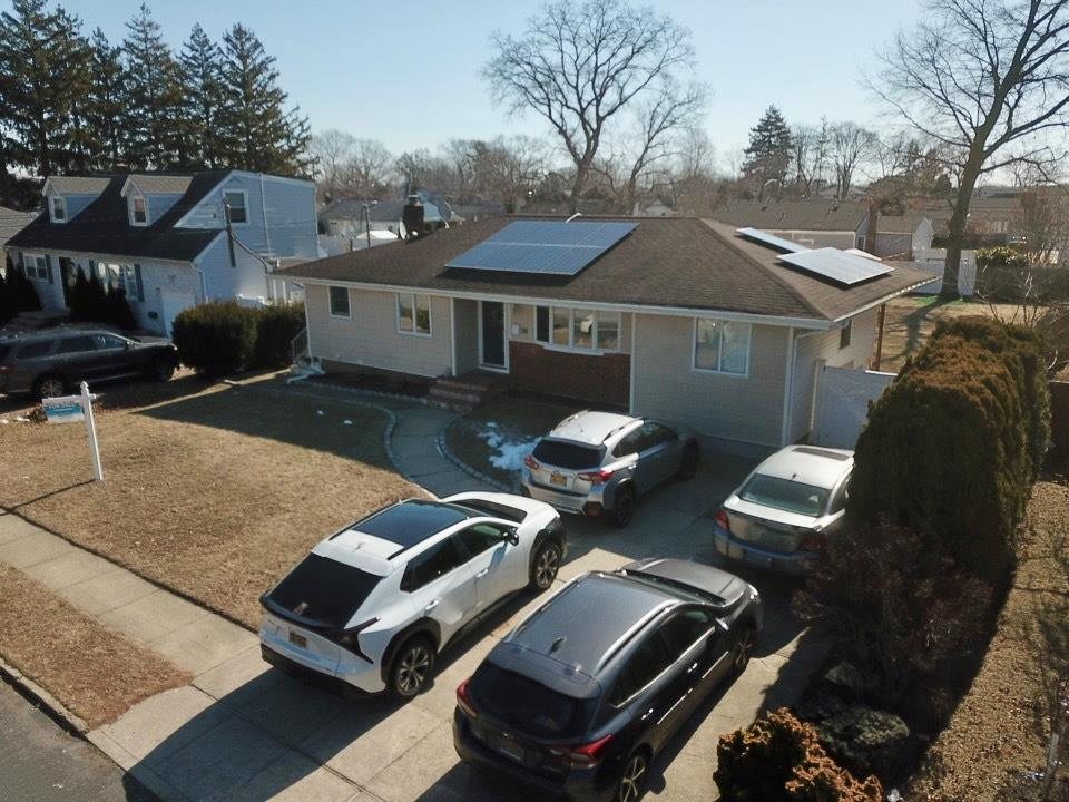 a front view of house with yard barbeque oven and outdoor seating