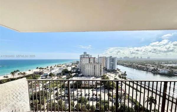 a view of a balcony with city