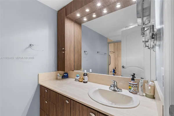 a bathroom with a sink and a mirror