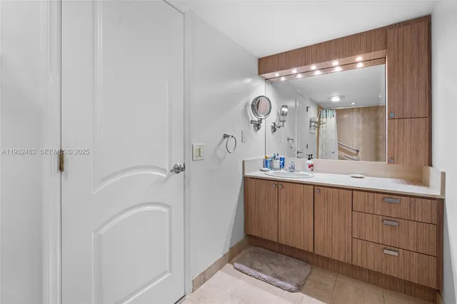 a spacious bathroom with a double vanity sink mirror and double