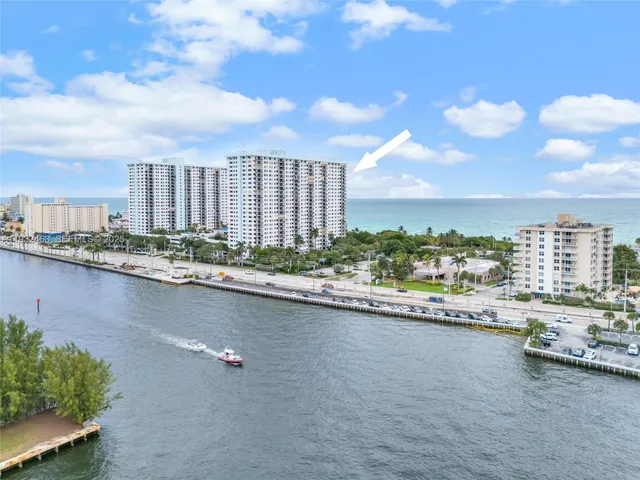 a swimming pool with outdoor seating and garden