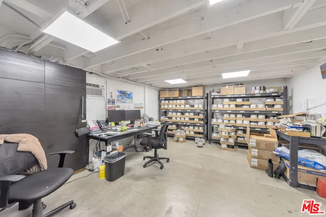 a room with furniture and air hockey table