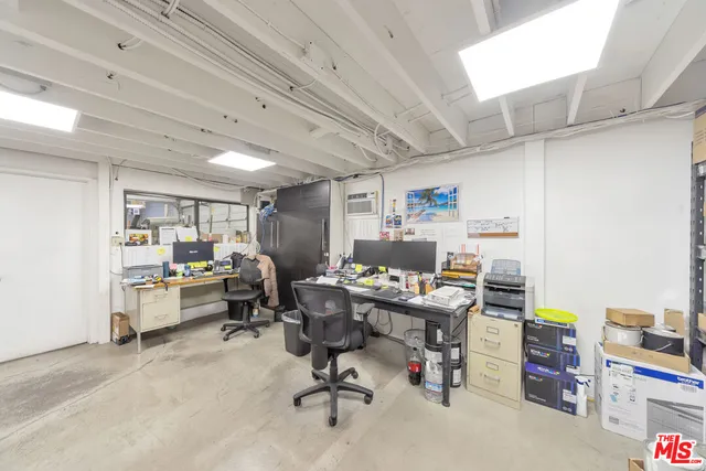a view of a workspace with furniture