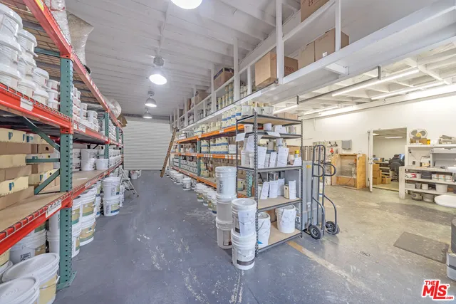 a view of an empty room with lots of furniture