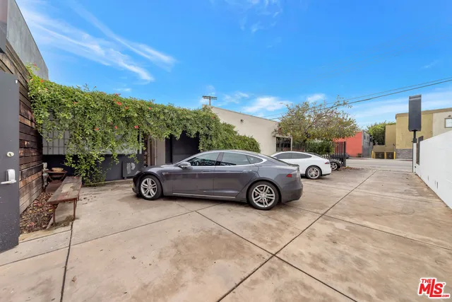 a view of a car parked in back of a building