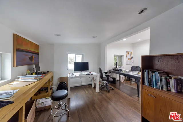 a view of a livingroom with furniture and a flat screen tv
