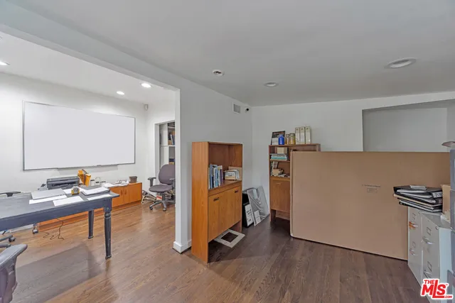 a view of workspace with wooden floor