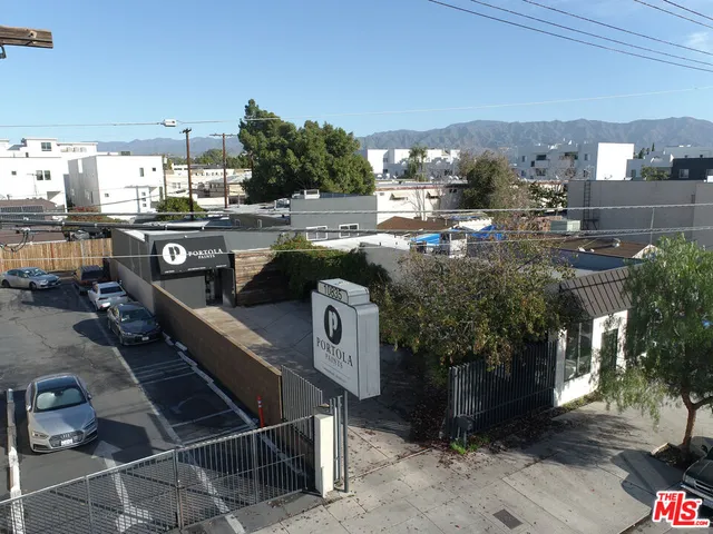 a terrace with outdoor seating and city view
