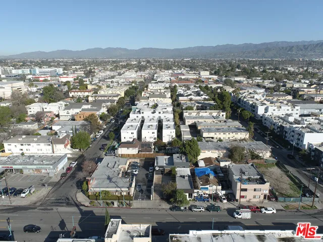 an aerial view of residential building and parking space
