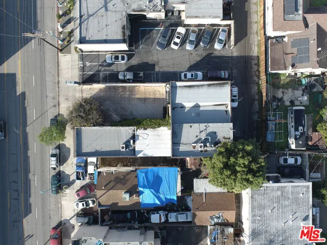 a view of a patio with table and chairs and potted plants