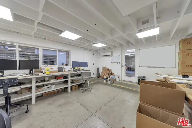 a view of a workspace with furniture