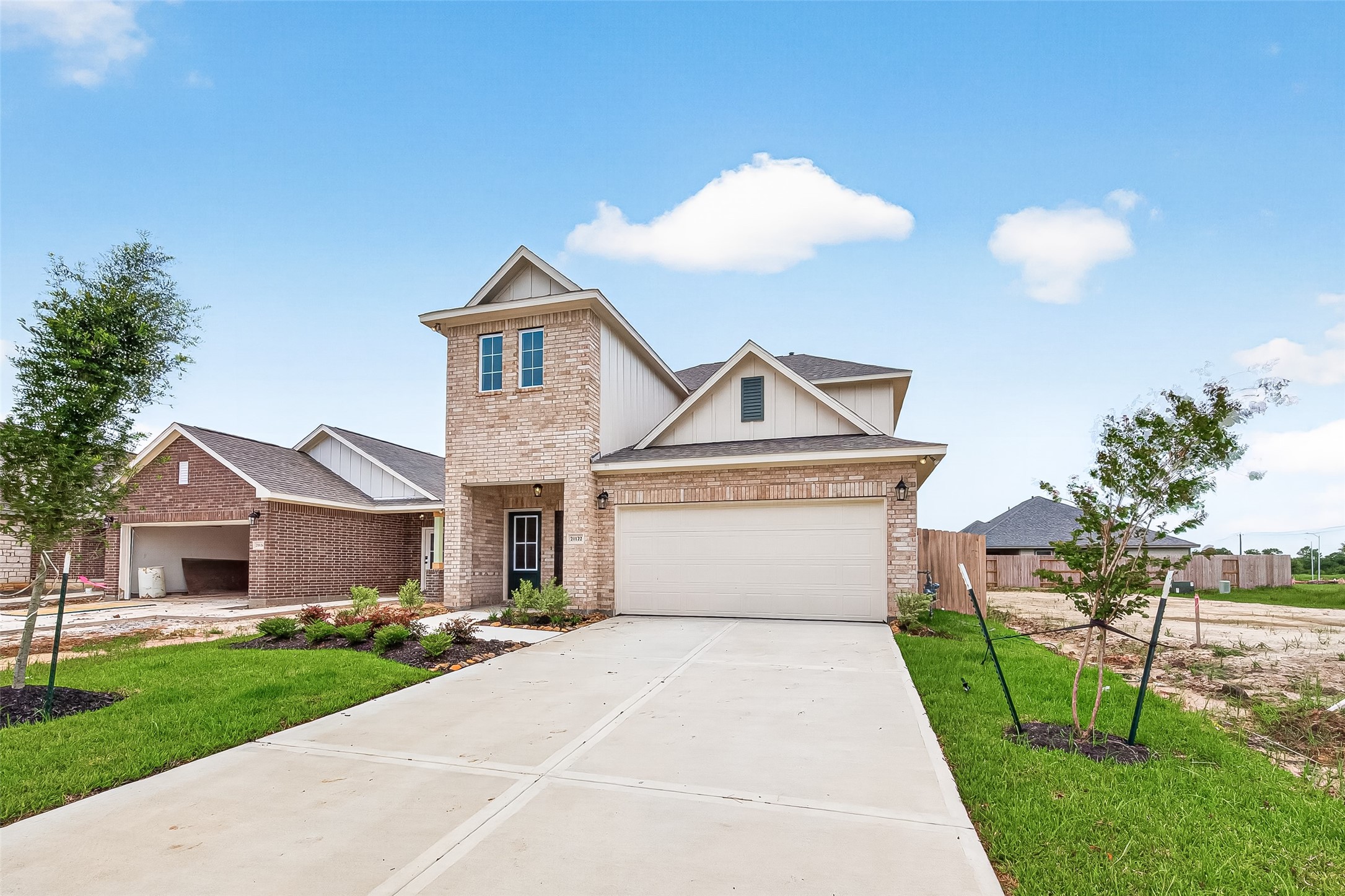21122 Autumn Heights Rosharon, TX 77583 - Photo 2 of 42 a front view of a house with a yard and garage