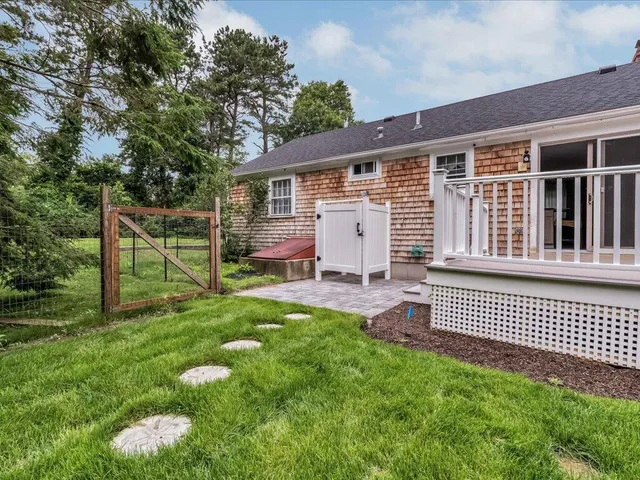 a backyard of a house with seating space