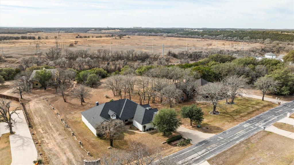 4801 West Wedgefield Road Granbury, TX 76049 - Photo 36 of 40 a view of a lake with couches and city view