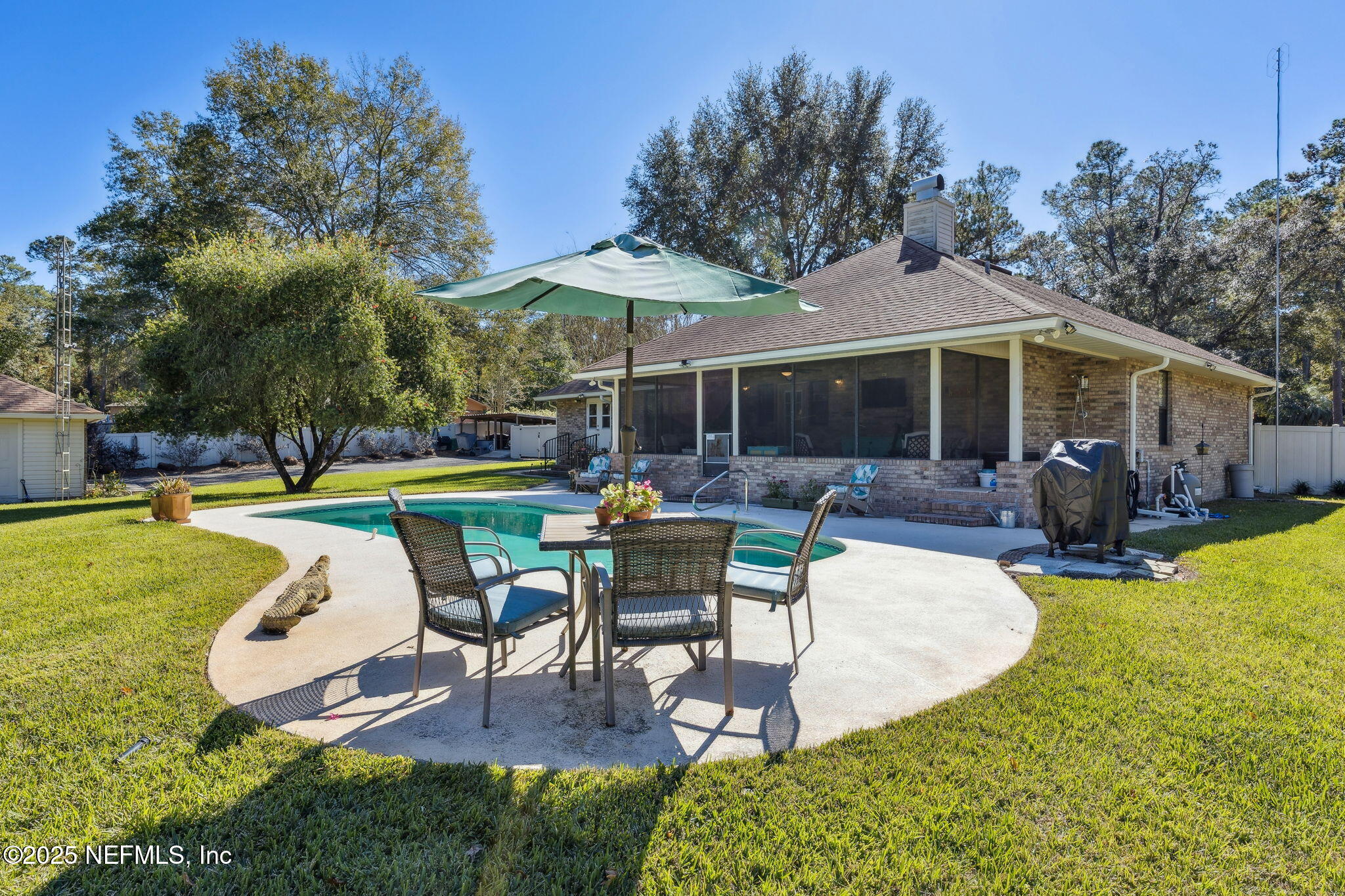 a view of a house with swimming pool and porch with furniture