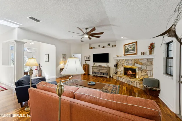 a kitchen with stainless steel appliances granite countertop a refrigerator a stove and a sink